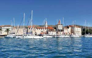 a group of boats are docked in a harbor at House Morski brk in Trogir