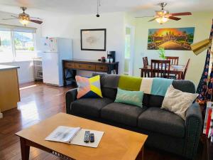 a living room with a couch and a table at The Perfect Escape in Kailua