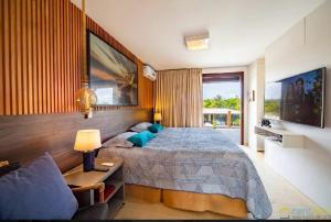 Ένα ή περισσότερα κρεβάτια σε δωμάτιο στο Casa em Costa do Sauipe para carnaval e temporada +20 φωτογραφίες