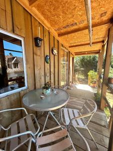 Balkón nebo terasa v ubytování Cabaña los Gansos Playa Bosque Grill Wi-Fi TV