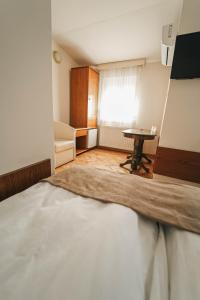 Letto o letti in una camera di B&B Passage