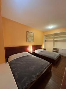 Postel nebo postele na pokoji v ubytování Huntley Inn