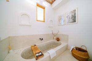 a bathroom with a large tub in a room at Marram Villas Prime Location in Paje +24 photos