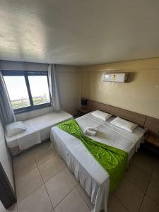 En eller flere senge i et værelse på KARIRI BEACH_CUMBUCO BOUTIQUE APARTMENTS + 19 billeder