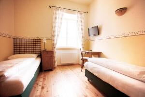 Postel nebo postele na pokoji v ubytování Hotel-Gasthof Weitgasser