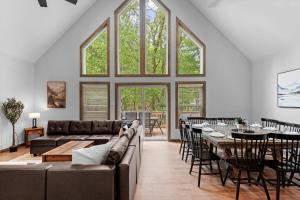 a living room with a couch and a table at Twin Chalet 6 BDs Hot Tub Game Area and more in Albrightsville