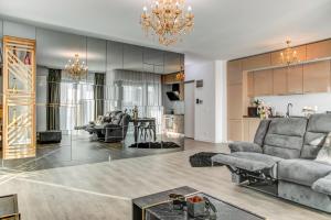 a living room with a couch and a table at LemonApartments in Bucharest