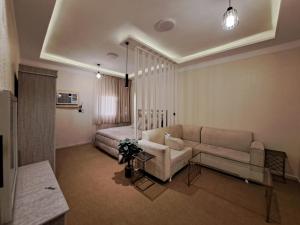 Χώρος καθιστικού στο Cozy Home