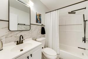 a bathroom with a sink and a toilet and a shower at Hot Tub and Game Room Long Pond Getaway! in Long Pond +23 photos