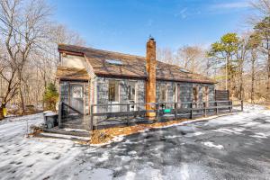 a house that is sitting in the snow at Hot Tub and Game Room Long Pond Getaway! in Long Pond