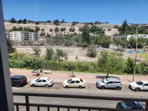 a group of cars parked in a parking lot at Departamento en Vallenar in Vallenar