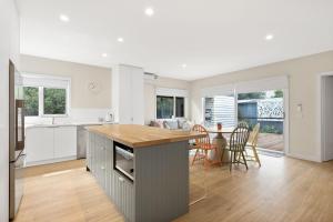 a kitchen and dining room with a table and chairs at Aberdeen in Cowes