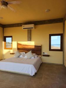 Ένα ή περισσότερα κρεβάτια σε δωμάτιο στο Casa de Playa