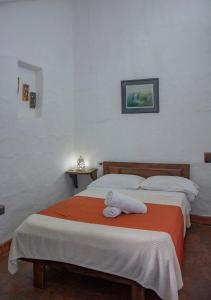 Postel nebo postele na pokoji v ubytování Casa Laurel Y Tomillo