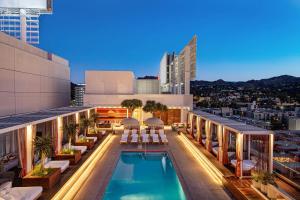 a hotel with a pool on the roof of a building at W Hollywood in Los Angeles