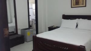 Postel nebo postele na pokoji v ubytování Hotel La Vieja Sara