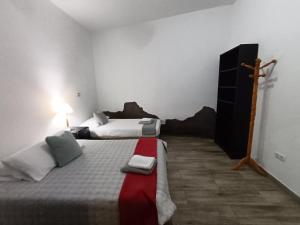 Postel nebo postele na pokoji v ubytování Villa de Ingenio JAVAZU