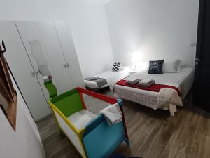 Postel nebo postele na pokoji v ubytování Villa de Ingenio JAVAZU
