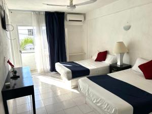 Ένα ή περισσότερα κρεβάτια σε δωμάτιο στο Hotel Independencia