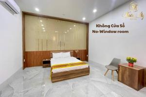 Postel nebo postele na pokoji v ubytování Khách Sạn Thiên Mỹ
