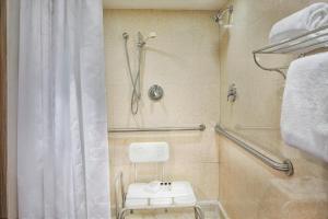 a bathroom with a shower and a toilet at Sheraton Philadelphia University City Hotel in Philadelphia
