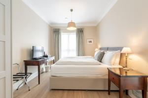 Postel nebo postele na pokoji v ubytování Derwent Lodge