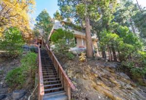 a staircase leading to a house in the woods at Views inside Yosemite-Timber Lodge-Sleeps 6 in Yosemite West