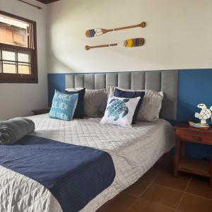 Postel nebo postele na pokoji v ubytování POUSO DE ICARO - POUSADA NO CENTRO de PARATY