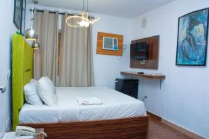 Postel nebo postele na pokoji v ubytování Ontario Hotel & Apartment + 37 fotografií