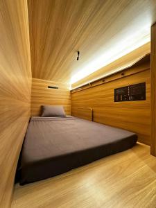 Postel nebo postele na pokoji v ubytování Dosare Capsule Hotel + 6 fotografií