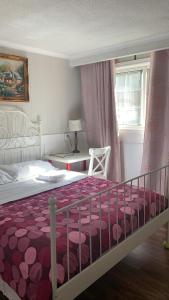 Postel nebo postele na pokoji v ubytování Arkona Home