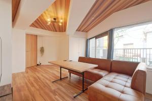 a living room with a couch and a table at V Close to Kyodo sta 12 min to Shinjuku in Tokyo +7 photos