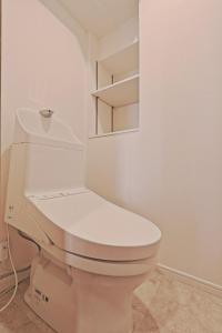 a bathroom with a white toilet in a room at V Close to Kyodo sta 12 min to Shinjuku in Tokyo