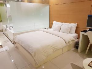 Ένα ή περισσότερα κρεβάτια σε δωμάτιο στο Hotel Star