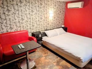 Postel nebo postele na pokoji v ubytování Hotel RIO新宿