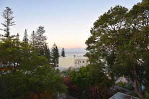 a view of a house from the trees at Jubilee Apartment 14 in South West Rocks