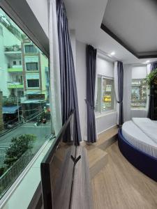 Ένα ή περισσότερα κρεβάτια σε δωμάτιο στο APEC BnB Hotel +44 φωτογραφίες