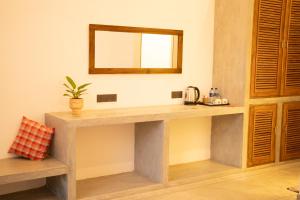 a counter in a room with a mirror on the wall at Bebe peak weligama in Weligama