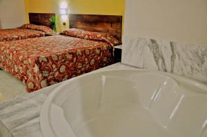 Postel nebo postele na pokoji v ubytování Hotel Marimba Punta Cana