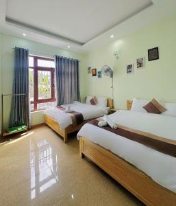 Postel nebo postele na pokoji v ubytování Alex Home Đà Lạt