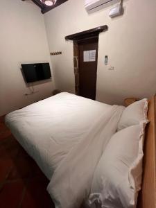 Postel nebo postele na pokoji v ubytování 心如所院民宿