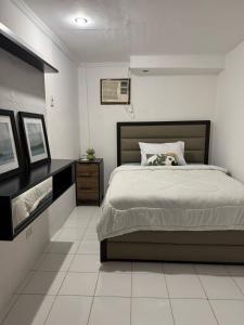 a bedroom with a large bed in a room at Azor D' Boracay in Boracay +7 photos