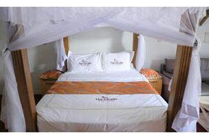 Voodi või voodid majutusasutuse The Giraffe Cottages toas
