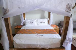 Voodi või voodid majutusasutuse The Giraffe Cottages toas
