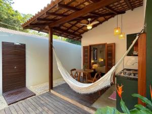 a hammock on the patio of a house at Recanto Alter do Chão in Alter do Chao