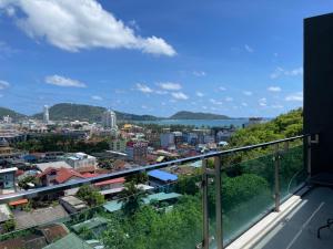 a view of a city from the balcony of a building at Emerald Terrace Resort 2 bedrooms Panoramic Ocean View Top Floor in Patong Beach