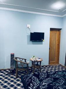 TV a/nebo společenská místnost v ubytování The Aastana