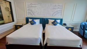 Cosmo Stars Hotel Bạc Liêu 객실 침대