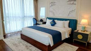 Cosmo Stars Hotel Bạc Liêu 객실 침대