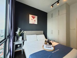 a bedroom with a bed and a large window at SKS Pavillion Residences Johor Bahru in Johor Bahru +160 photos